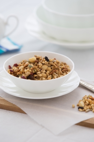 Bowl of organic Granola served at a table - Australian Stock Image