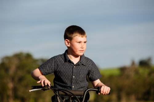 Boy and motorbike - Australian Stock Image