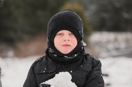 Boy in the snow. Winter at Shooter's Hill, NSW - Australian Stock Image