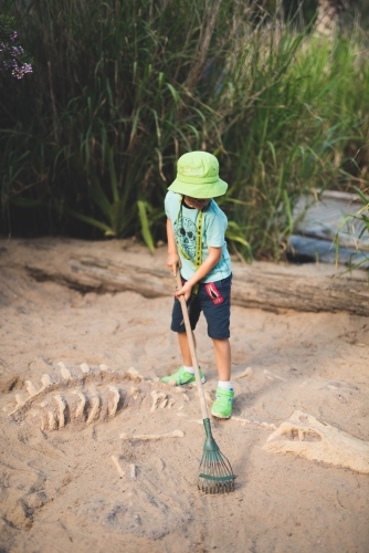 Boy playing in the sand - Australian Stock Image