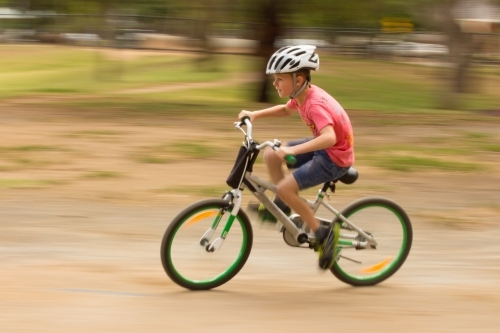 Boy riding bike - Australian Stock Image