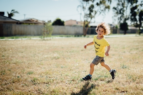 Boy running in a park