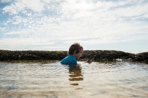 Boy swimming in Rockpool - Australian Stock Image