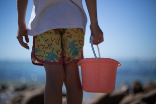 Boy with bucket - Australian Stock Image
