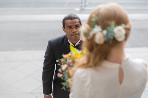 Bridal photos flowers in hair first look - Australian Stock Image