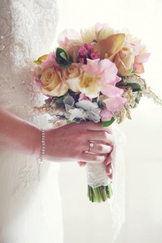 Bride holding bouquet of flowers - Australian Stock Image