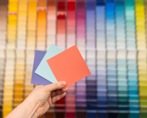 bright colours of paint sample cards in a hardware store - Australian Stock Image
