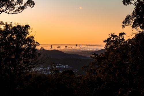Brisbane city at sunrise covered in fog - Australian Stock Image