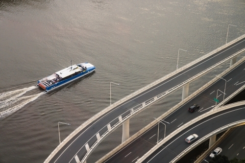 Brisbane ferry CityCat public transport cruising along the Riverside Expressway - Australian Stock Image