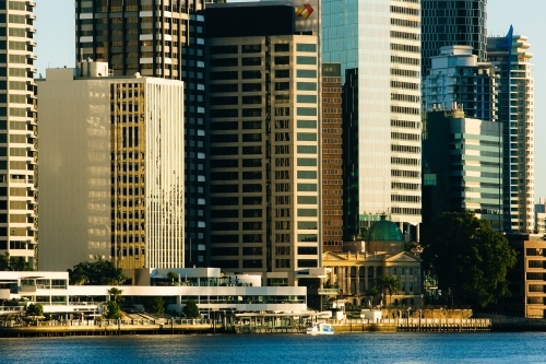 Brisbane River and city buildings along the riverfront early in the morning - Australian Stock Image