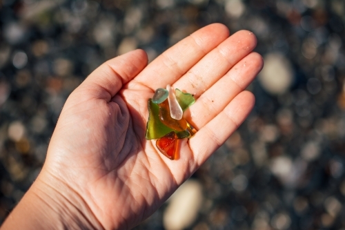 Broken glasses on a hand - Australian Stock Image