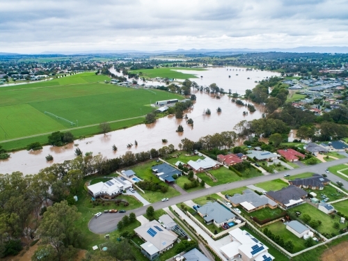 Brown floodwaters of Hunter River in Singleton