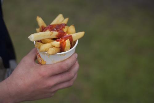 Bucket of chips with sauce - Australian Stock Image
