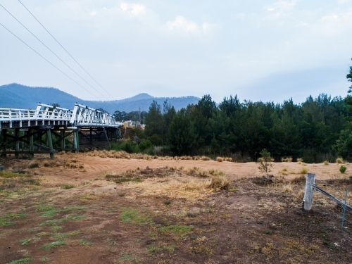 Bulga bridge over stagnant creek on overcast day - Australian Stock Image