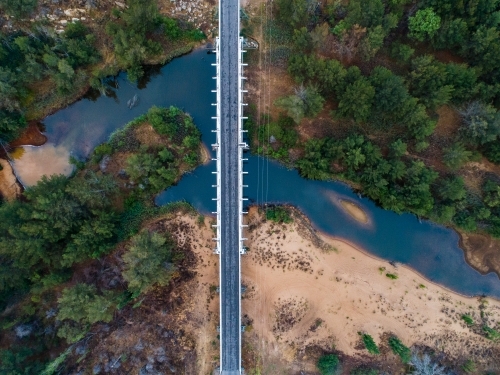 Bulga bridge over stagnant creek on overcast day - Australian Stock Image