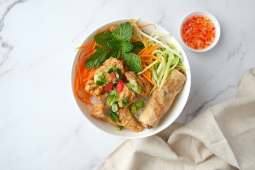 Bun Cha Gio bowl topped with fried spring roll and Cha Lua. - Australian Stock Image