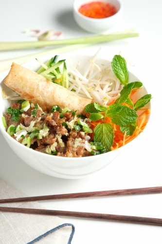 Bun Cha Gio bowl with meat slices topped with fried spring roll. - Australian Stock Image