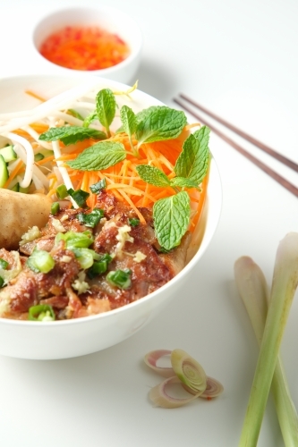 Bun Cha Gio bowl with meat slices topped with fried spring roll. - Australian Stock Image
