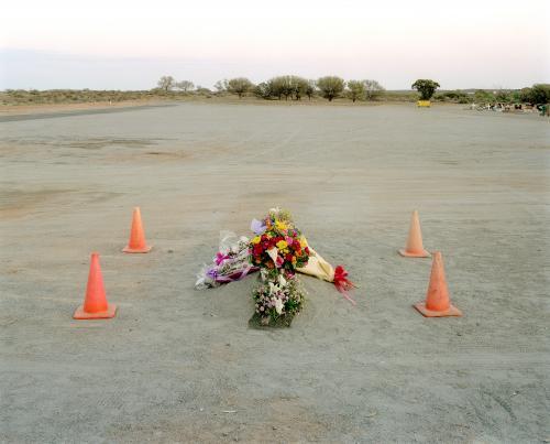 Burial site in remote town with flowers