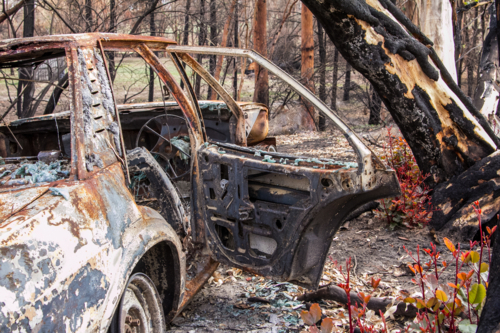 burnt out car after bushfire - Australian Stock Image