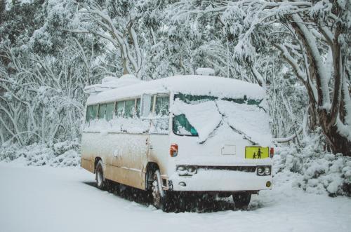 Bus covered in snow