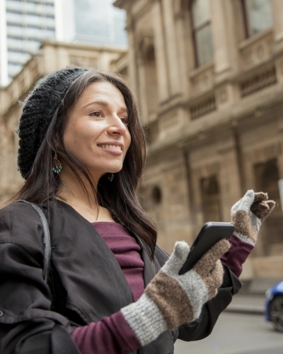 Business Woman Hailing a Taxi - Australian Stock Image
