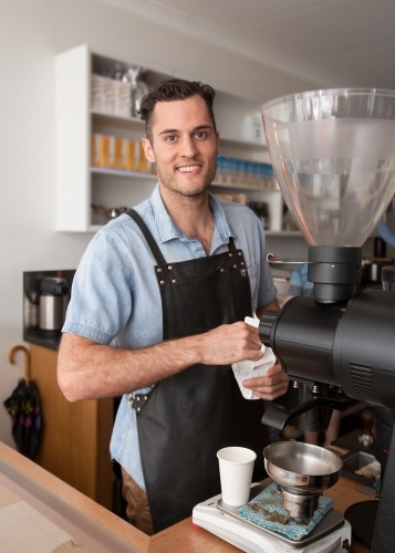 Cafe owner making coffee - Australian Stock Image