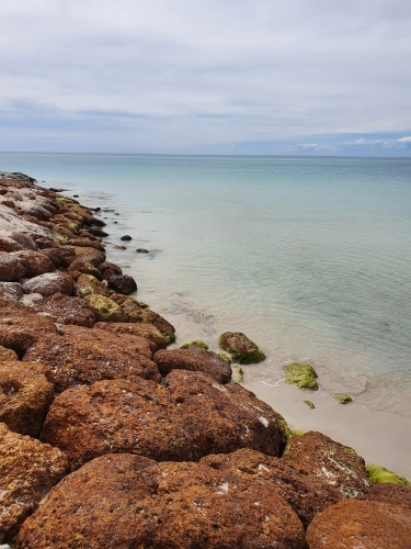 Calm beach with rocks - Australian Stock Image