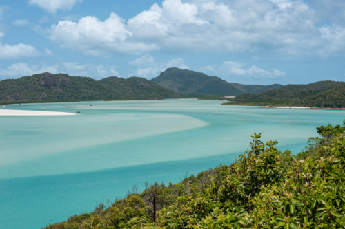 calm ocean water and hilly outcrops of islands - Australian Stock Image