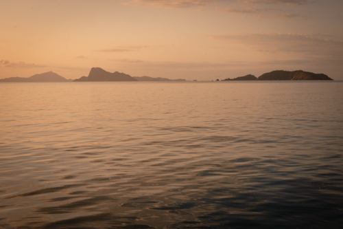 calm ocean water and hilly outcrops of islands - Australian Stock Image