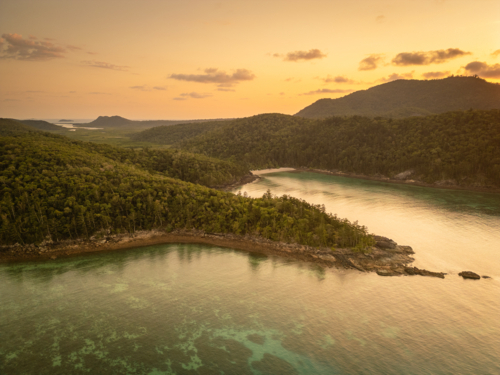 calm ocean water and hilly outcrops of islands - Australian Stock Image