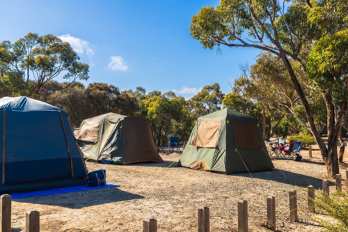 Camping site with tents set up on a day, Deep Creek, Fleurieu Peninsula, South Australia - Australian Stock Image