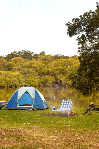 Camping tent built beside the lake - Australian Stock Image