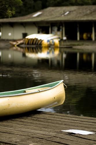 Canoe near boat shed with boats in back ground