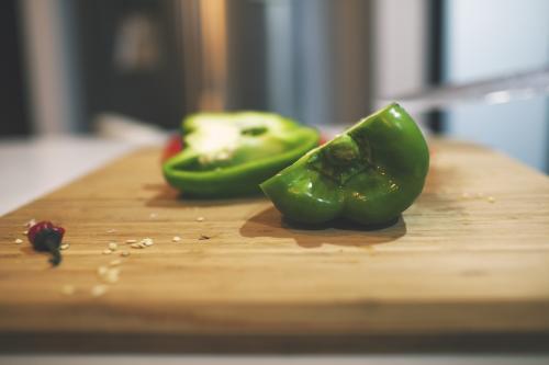 Capsicum on cutting board - Australian Stock Image