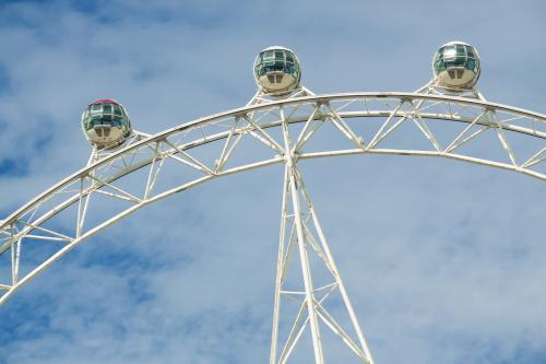 Capsules on a large ferris wheel, high in the sky