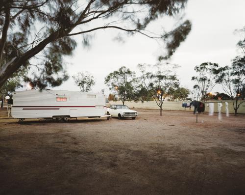 Car and caravan in outback camp ground - Australian Stock Image