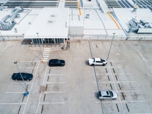 Car park beside shopping center in town - Australian Stock Image