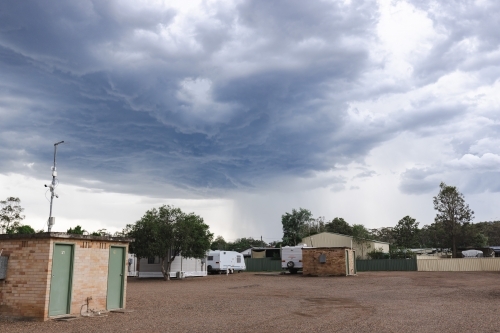Caravan and cabin park on stormy day - Australian Stock Image