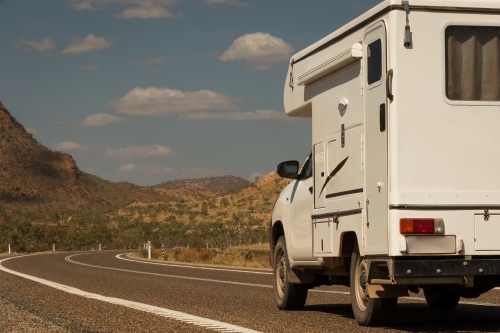 Caravan driving on regional road - Australian Stock Image