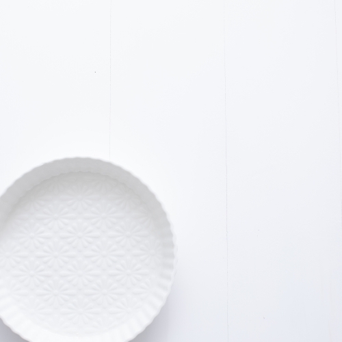 Ceramic pie dish on blank background
