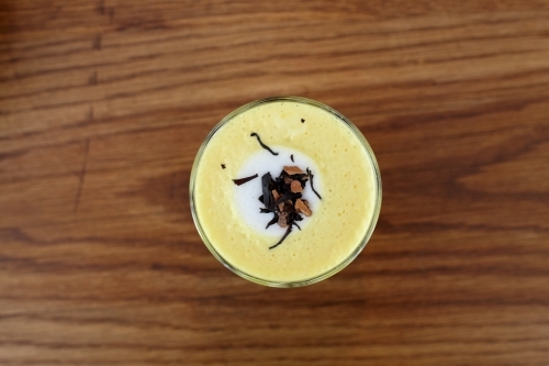 Chai and turmeric latte tea prepared on table in cafe - Australian Stock Image