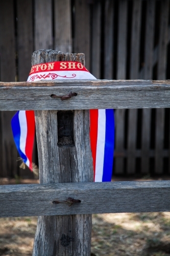 Champion show ribbon around wooden post at showground