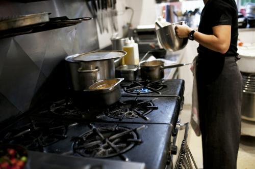 Chef cooking in cafe kitchen