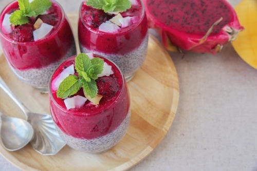 Chia seeds pudding with red dragon fruit and mango - Australian Stock Image