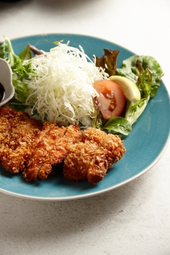 Chicken katsu with salad - Australian Stock Image