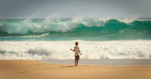 Child and waves at the beach, Yorke Peninsula, South Australia - Australian Stock Image