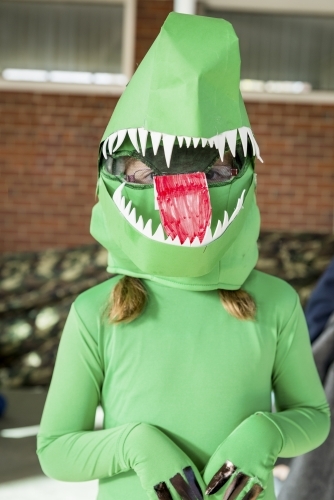 Child in Green Dinosaur Costume