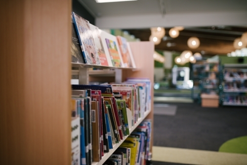 Children's books on a library shelf - Australian Stock Image