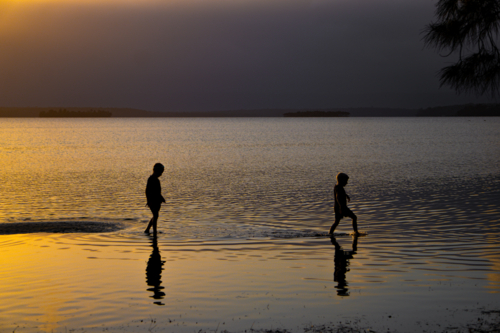 Children walking on water - Australian Stock Image